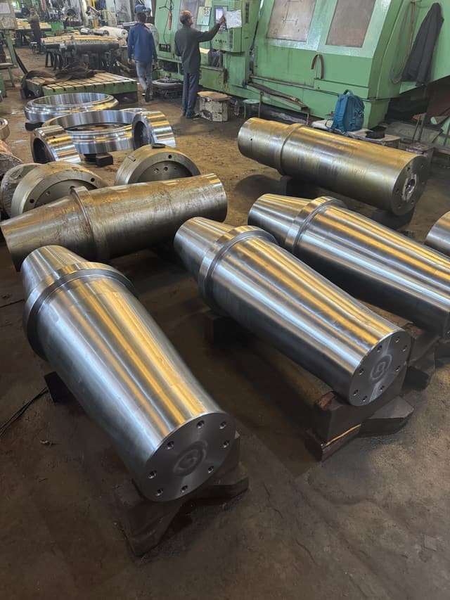 A crusher shaft after rough turning, its eccentric section stepped.