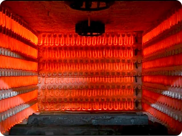 A charge of shafts inside the electrical tempering furnace.